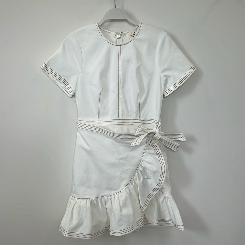 Cinq a sept white dress with tan stitching.
